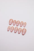 Sheer nude and hailey bieber glazed  pearl chrome French tip press-on nails set flatlay