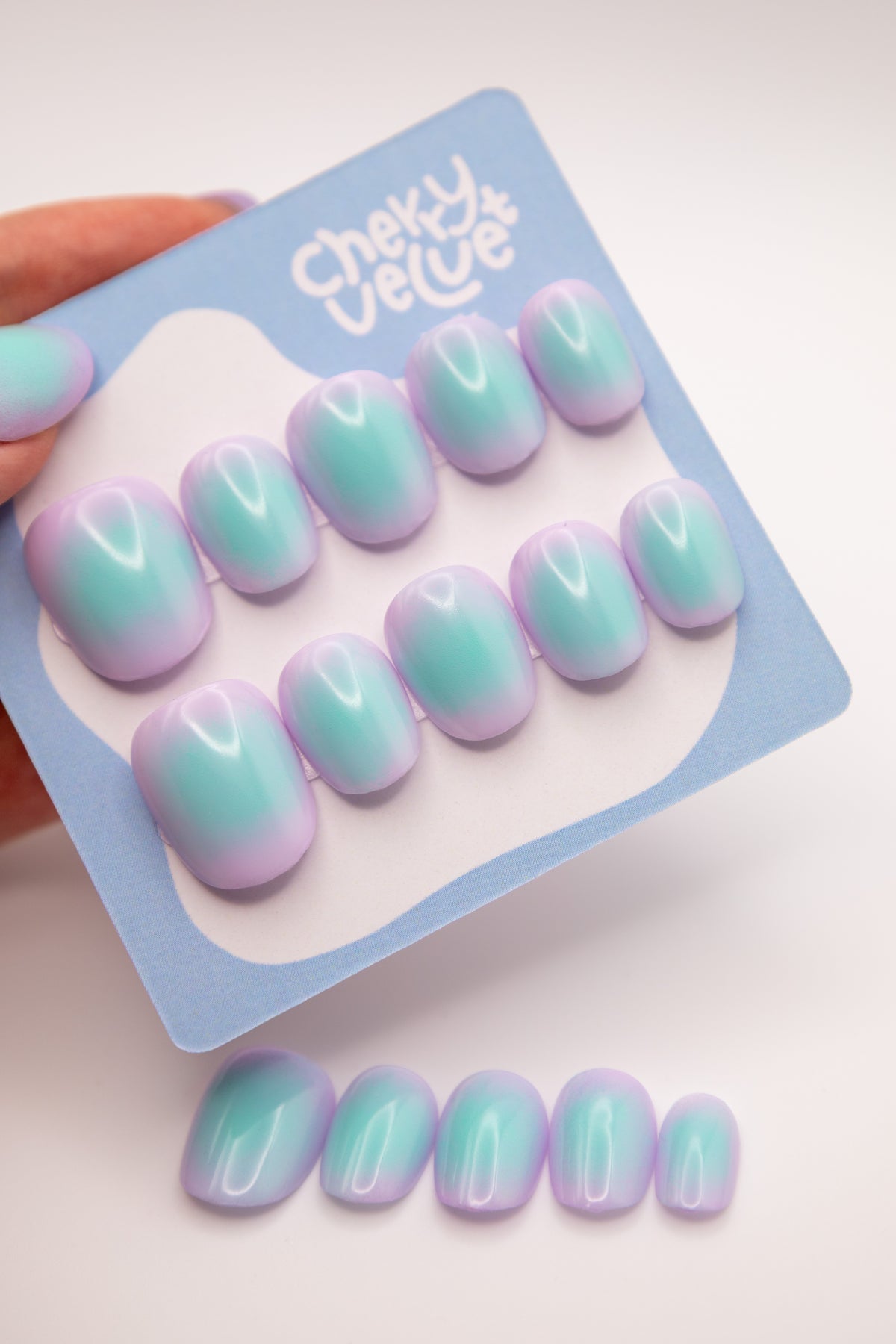 Display card showing glossy lavender and mint blush aura short square press-on nails