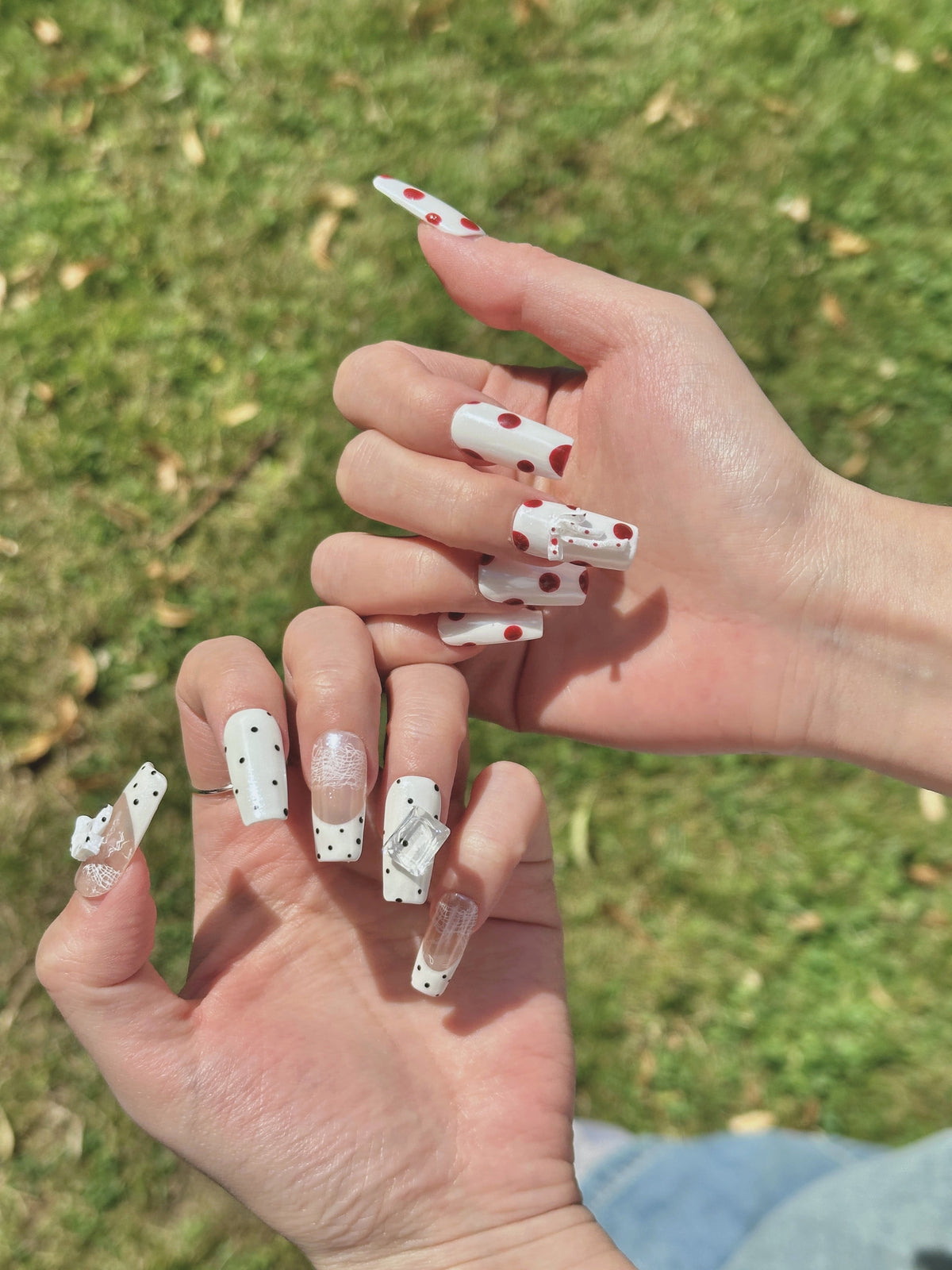 Pale Ribbon coquette coffin press-on nails with polka dots and ribbon bow on hand