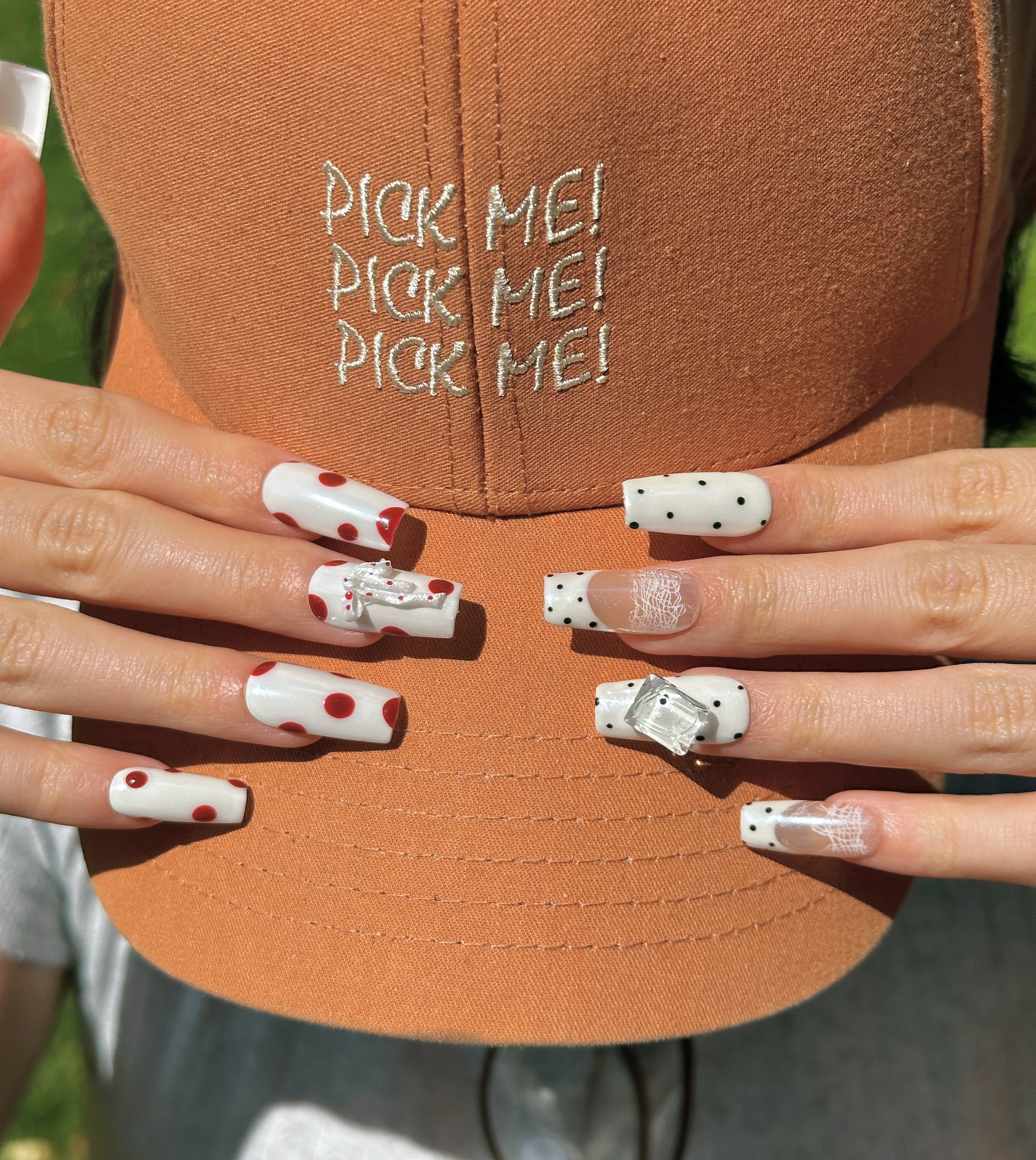 Pale Ribbon coquette coffin press-on nails with polka dots and ribbon bow on hand