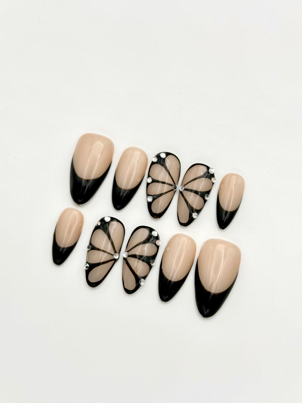 Shadow Wings black butterfly French tip almond press-on nails set with rhinestones