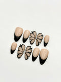 Shadow Wings black butterfly French tip almond press-on nails set with rhinestones