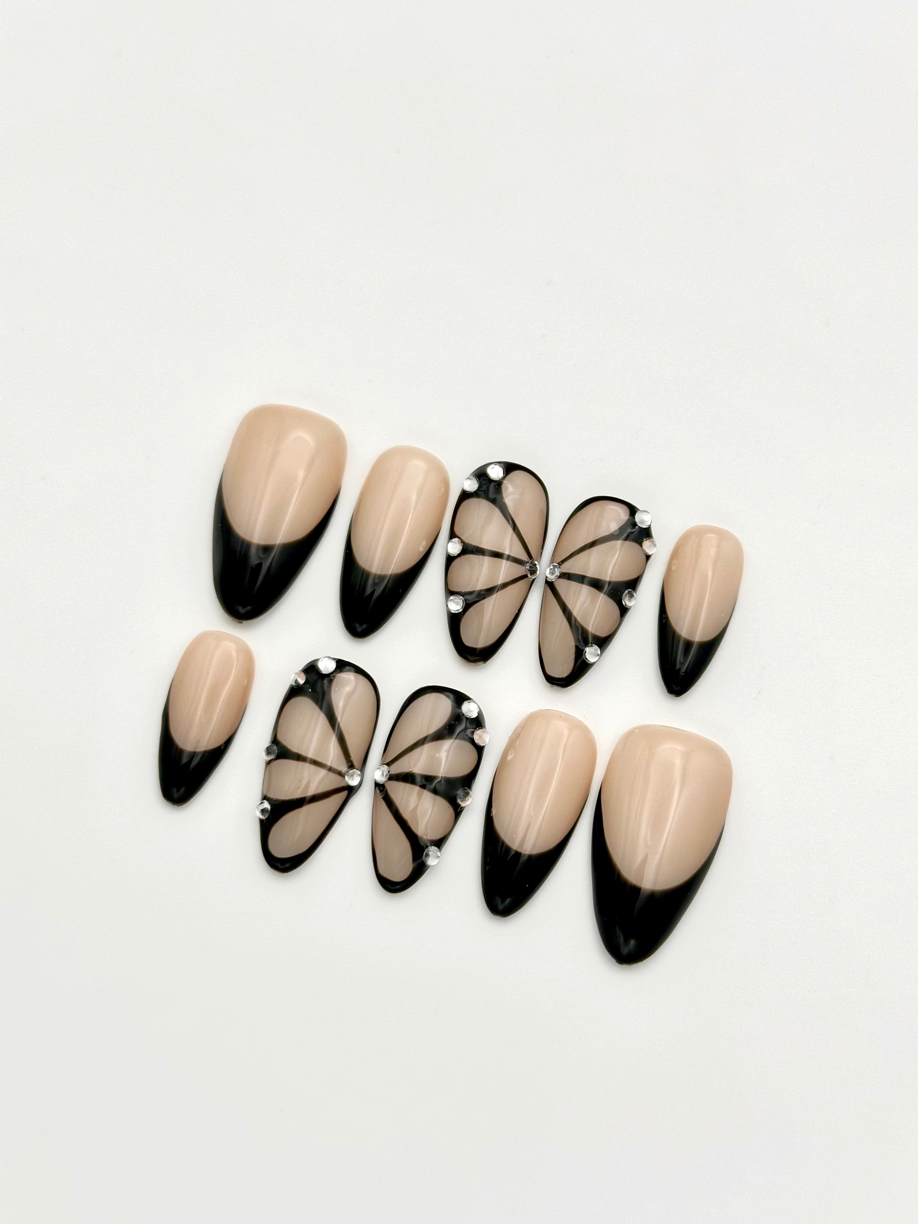 Shadow Wings black butterfly French tip almond press-on nails set with rhinestones